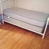 Twin size bed with matress and box springs and frame
